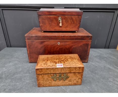 A 19th century figured ash tea caddy, with elaborate brass escutcheon, 24.5cm wide; together with a George III mahogany sarco