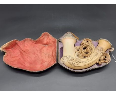 A large and elaborate late 19th century carved Meerschaum pipe bowl, 21.5cm wide, in fitted case.
