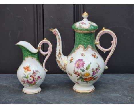 A Dresden porcelain coffee pot &amp; cover and matching cream jug, former 21cm high. (2)