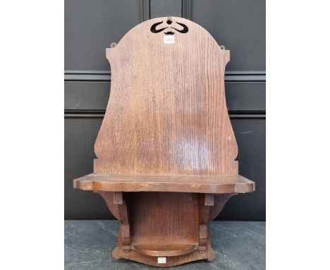 A large oak clock bracket, 73 x 44.5cm.