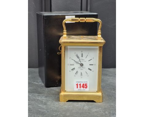 A good brass carriage clock, the enamel dial inscribed 'L'Epee', with push button repeat, striking on a gong, height includin