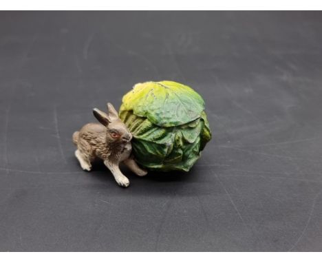 A cold painted spelter rabbit and lettuce inkwell, 5.5cm long.