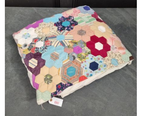 A patchwork single quilt. 