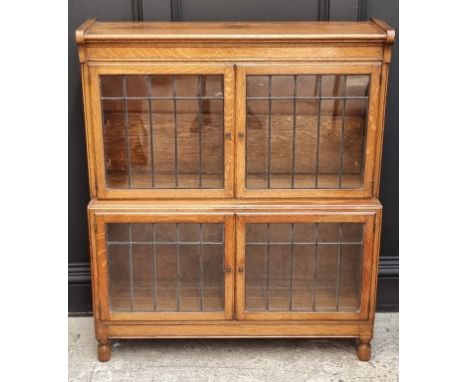 A Globe Wernicke style oak and leaded glass bookcase, 89cm wide, (crack to one pane).
