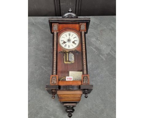 An unusual late 19th century German musical wall clock, 59.5cm high, with pendulum.