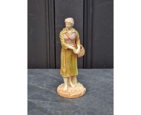 A Royal Worcester shot enamel figure of a Dutch fisherwoman, model 1202, 19.5cm high.