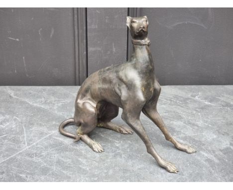 A bronze seated greyhound, 26cm high.