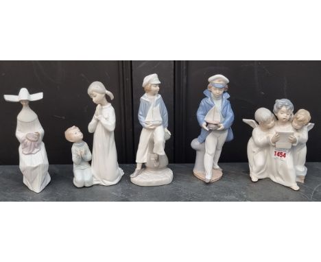 Five Lladro figures, largest 22.5cm.