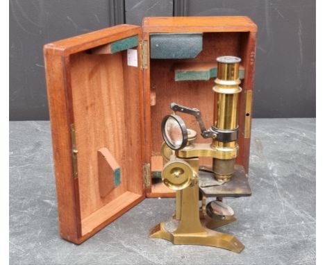 A late 19th century brass compound microscope, by M Pillischer, boxed with instructions.