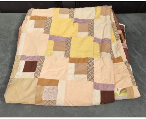 A large patchwork double quilt. 
