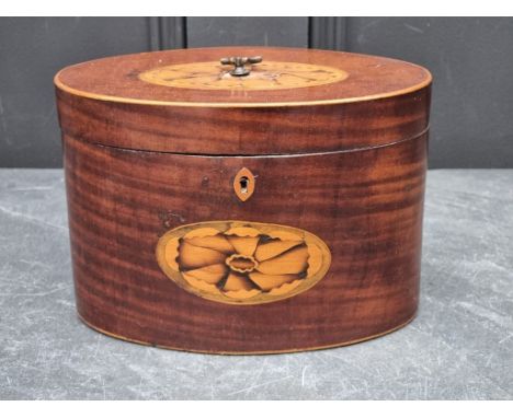 A George III mahogany and inlaid oval tea caddy, 20cm wide.