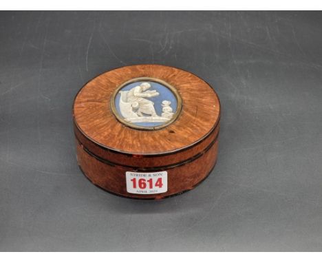 A 19th century tortoiseshell and burr wood box, the cover inset with a Jasperware panel, 11.5cm diameter.