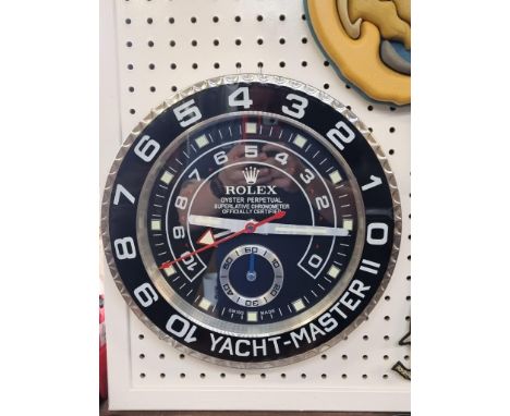 A Rolex style 'Yacht-Master II' wall clock,&nbsp;with battery movement, 34cm diameter.