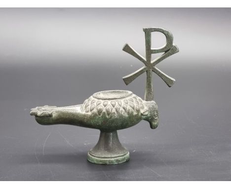 Antiquities: a Byzantine style bronze oil lamp, with Chi Rho handle, 12cm high.