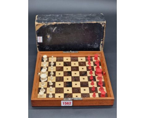 A scarce Jaques 'In Statu Quo' travelling chess set,&nbsp;with bone pieces, in folding chequerboard case, 23cm wide, with out