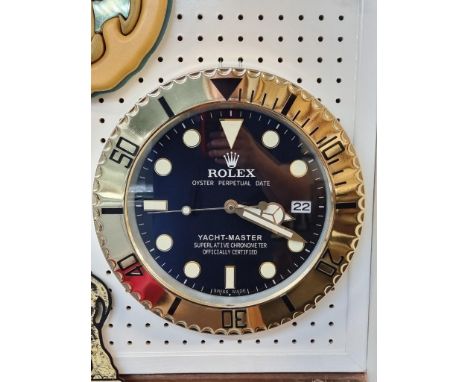 A Rolex style 'Yacht-Master' wall clock,&nbsp;with battery movement, 34cm diameter.