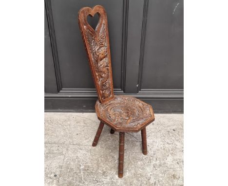 A Welsh carved oak spinning stool. 