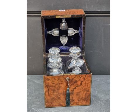 A Victorian figured walnut and brass decanter box, bearing ivory label inscribed 'E & E Emanuel, 3 The Hard, Portsea', enclos