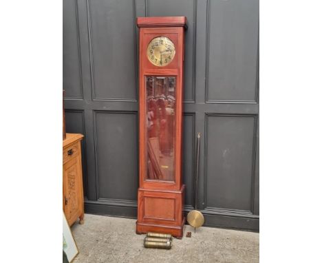 A 1920s mahogany longcase clock, with 10 1/2in brass circular dial, 215cm high, with pendulum and three brass weights.