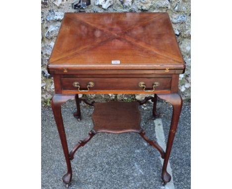A late Victorian mahogany envelope card table,&nbsp;with frieze drawer and platform undertier, 55.5cm wide.