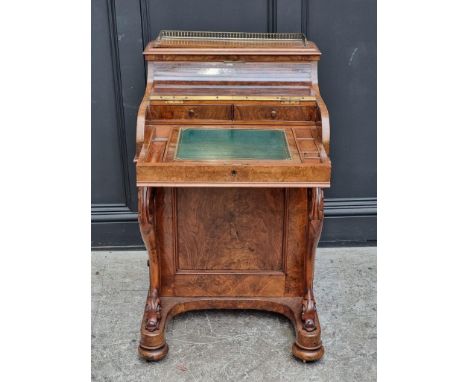 A Victorian figured walnut piano top secretaire Davenport, with gilt tooled leather inset surface and rising back, 55.5cm wid