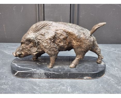 A bronze boar, on marble base, 28cm wide.