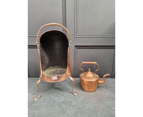 A 19th century copper tripod plate bucket, 60cm high; together with a Victorian copper kettle. (2)