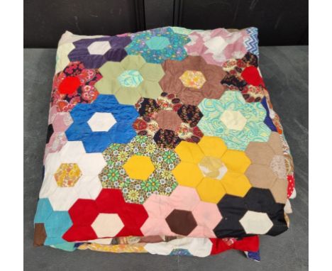 A large patchwork double quilt. 