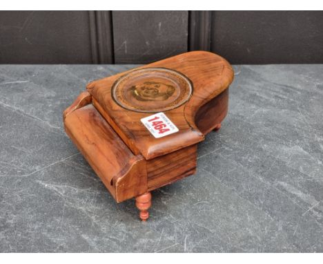 A vintage Swiss walnut novelty piano music box, by Reuge, 17cm long.