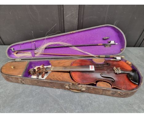 An antique Continental violin, labelled 'Joseph Cloz, An:1730', with 14 1/4in one-piece back, with two bows, in fitted walnut