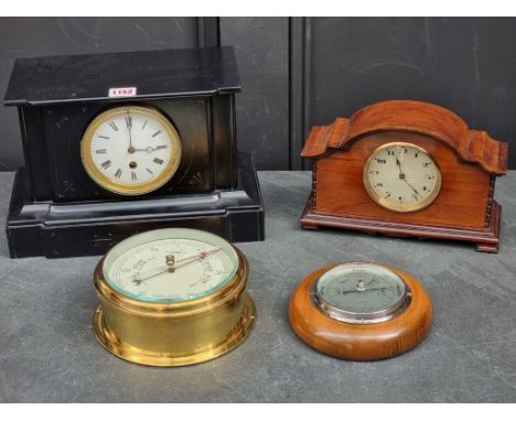 A slate mantel timepiece, 32cm wide; together with another Edwardian mahogany mantel timepiece; and two aneroid barometers. (