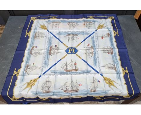 A Hermes 'La Marine en Bois' pattern silk scarf, in original packaging.