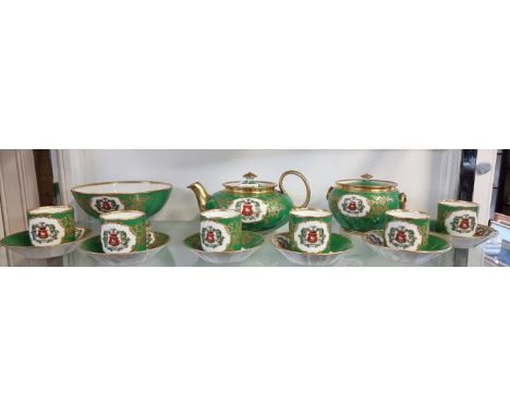 A French Feuillet Porcelain apple green ground armorial part tea service, Restauration Period, each piece finely gilt and pai