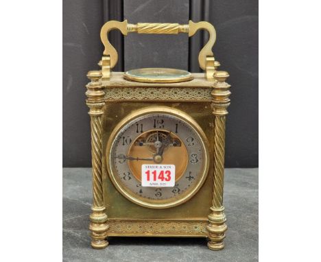 A large and unusual combined carriage clock and barometer, height including handle 22cm, with winding key.