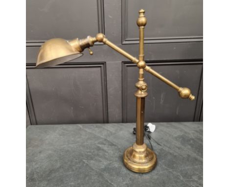 A lacquered brass articulated table lamp. 