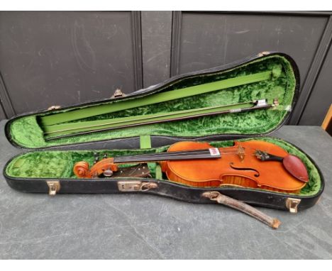 A good antique French violin, with 14in two-piece back, with bow, in padded case.