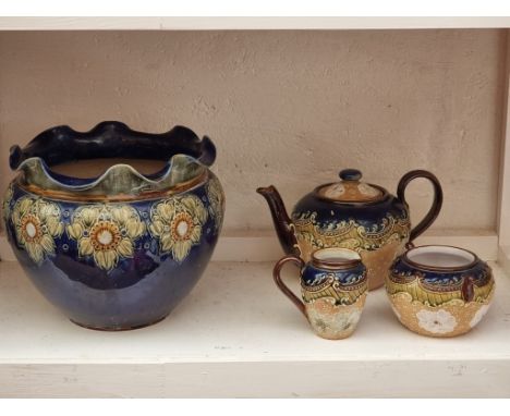 A Doulton Lambeth stoneware three piece tea set; together with a similar Royal Doulton jardinière, 19cm high. (4)