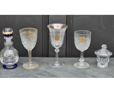 Two Baccarat cut glass gilt armorial glasses, largest 18.5cm high; together with another similar example; a small Baccarat cl