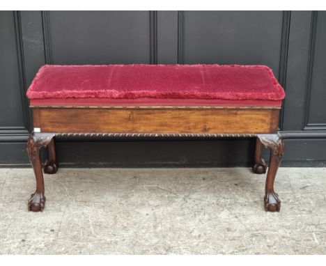 An 18th century style carved mahogany and upholstered box seat stool, 102.5cm wide.