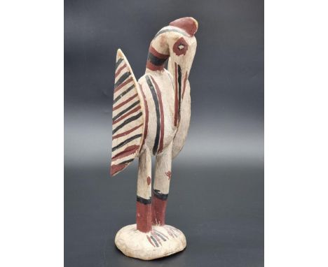 Ethnographica: a stained and carved wood Senufo bird, Ivory Coast, 33.5cm high.