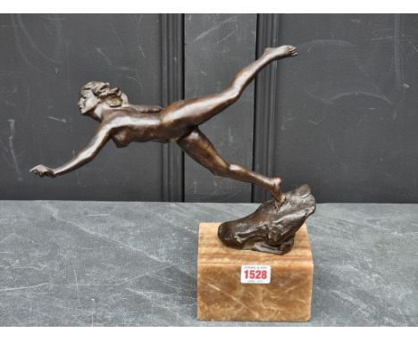 A bronze sculpture of a dancing nude, on marble base, 29cm high, (s.d.).
