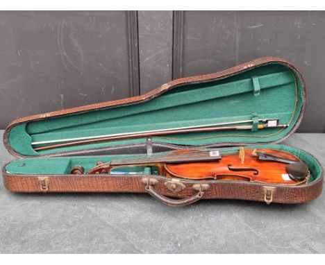 An antique Continental violin, with 14in two-piece back, with bow, in case.