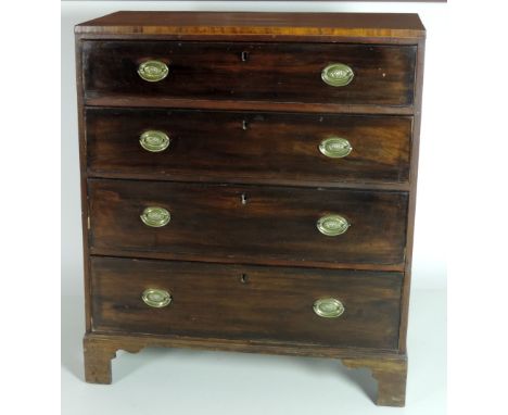 An early 19th Century mahogany Chest of four drawers, with oval brass handles, crossbanded top, on bracket feet, 92cms (36") 