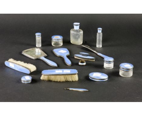 A 16 piece blue enamel Dressing Table Set, brushes, mirror, jars etc. A lot. (1)