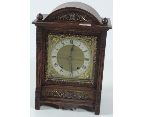 An attractive 19th Century brass mounted oak cased Mantle Clock, with silvered and brass dial. (1)