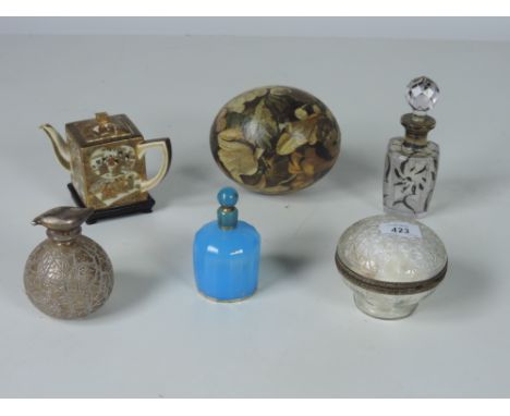 A small attractive Satsuma Teapot (lacks lid), with character mark, and four varied glass Scent Jars and stoppers, and a flor