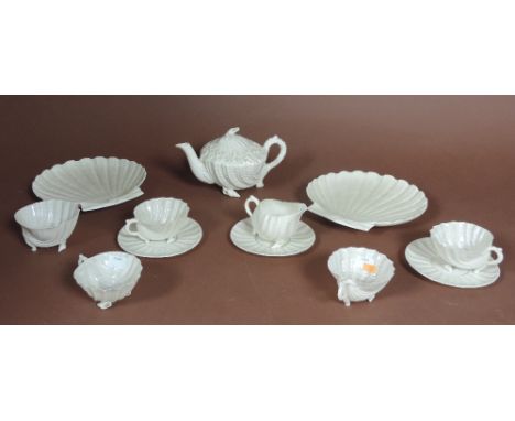 A pair of large Belleek shell shaped Dishes, with impressed mark, a Second Period shell shaped Teapot, Sugar Bowl and Cream J