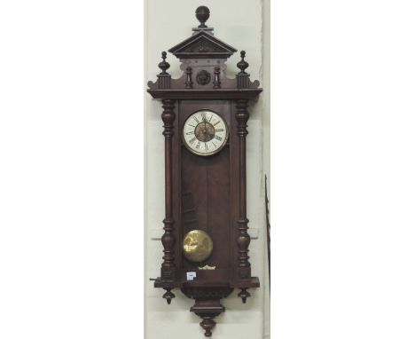 A large 19th Century walnut cased Vienna Wall Clock, with carved and decorated cornice over a large door ( lacking glass )  w