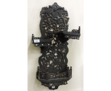 An unusual 19th Century carved Oriental fretwork three shelf  Wall Bracket, with ivory and mother-o-pearl mounts and brass in