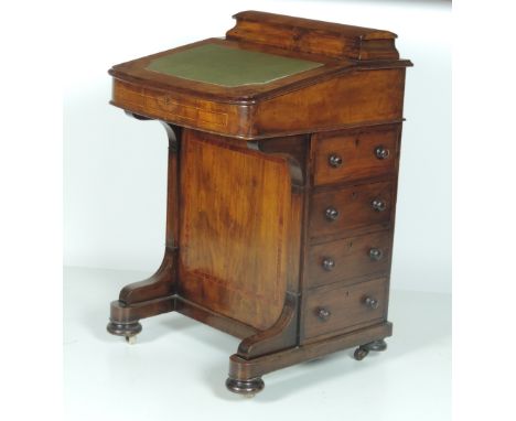 A Victorian period inlaid walnut Davenport Desk, with lift up stationery container, and slope top with leather inset, the bod
